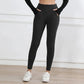 Black high-waisted leggings with pockets, paired with white sneakers for women's fashion