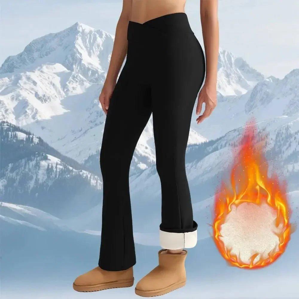 Women's black thermal leggings with fleece lining, perfect for winter fashion and warmth in snowy mountains.