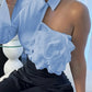 Light blue one-shoulder blouse with floral ruffle detail, paired with black embellished skirt for women's fashion