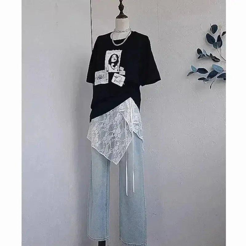 Black graphic tee with lace overlay, paired with light denim jeans for trendy women's fashion