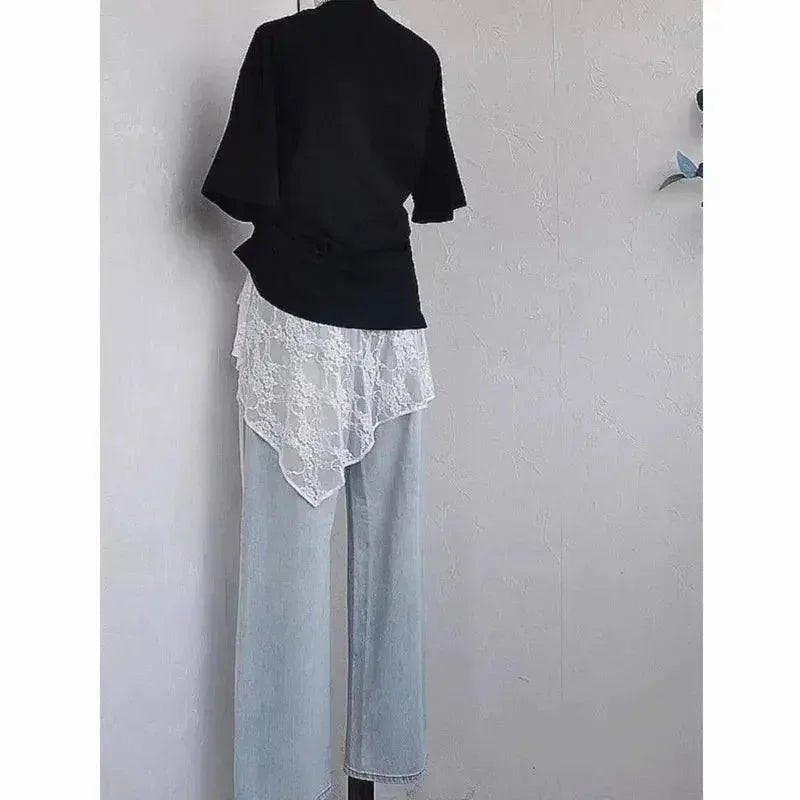 Black top with white lace overlay and light blue wide-leg jeans for women's fashion