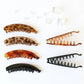 Stylish tortoiseshell and black hair claws for women’s fashion hairstyles