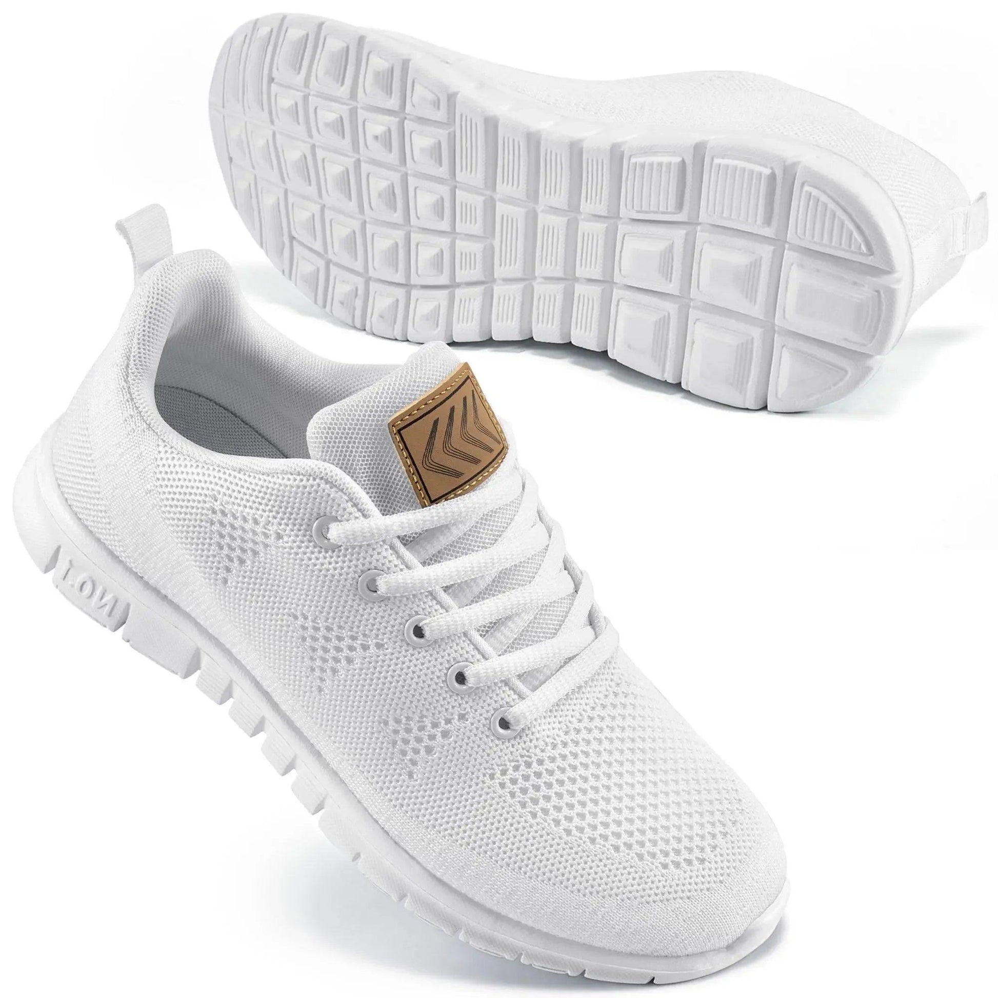 White women's mesh sneakers with tan heel tab, breathable design, and textured sole for comfort and style