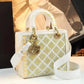 Elegant white and gold crystal-embellished handbag with quilted design and gold hardware, perfect for women's fashion.