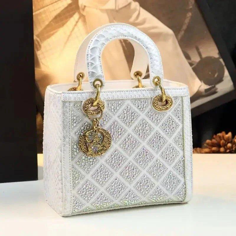 Elegant white crystal-embellished handbag with gold hardware, perfect for women's fashion and luxury style.