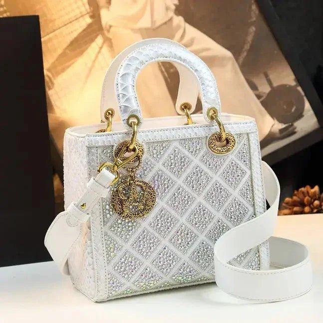Elegant white quilted handbag with crystal embellishments and gold hardware, perfect for women's fashion