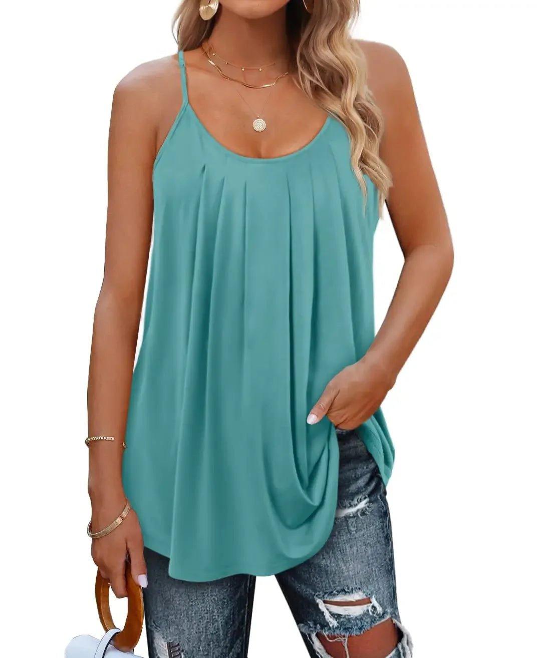 Teal women's pleated camisole top with spaghetti straps, paired with ripped jeans for casual fashion