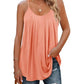 Peach pleated camisole top with spaghetti straps, paired with ripped jeans for casual women's fashion