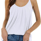White pleated camisole top with thin straps, paired with distressed jeans and gold necklace for casual women's fashion