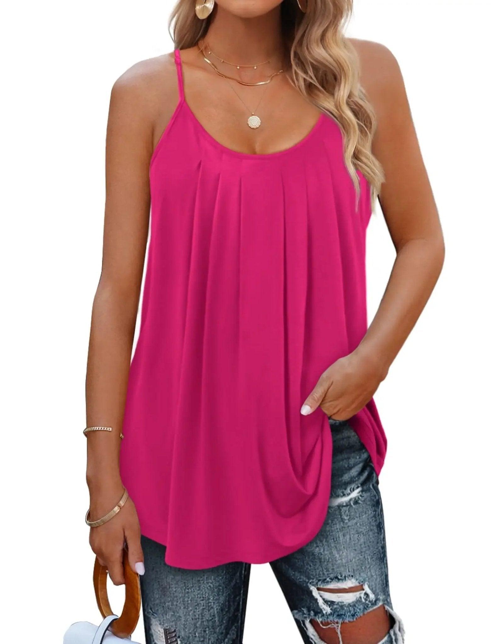 Pink women's pleated camisole top with thin straps, paired with ripped jeans and gold jewelry