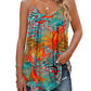 Tropical print women's tank top with colorful palm leaves, paired with ripped jeans for summer fashion