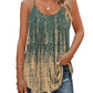 Green and beige patterned women's tank top with thin straps, paired with ripped jeans for casual fashion.