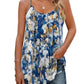 Blue floral print women's camisole top with gold accents, paired with ripped denim shorts for summer fashion