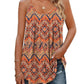 Boho patterned women's tank top with geometric print, paired with ripped jeans and gold jewelry