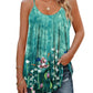 Teal floral print women's tank top with thin straps, paired with ripped denim shorts for summer fashion
