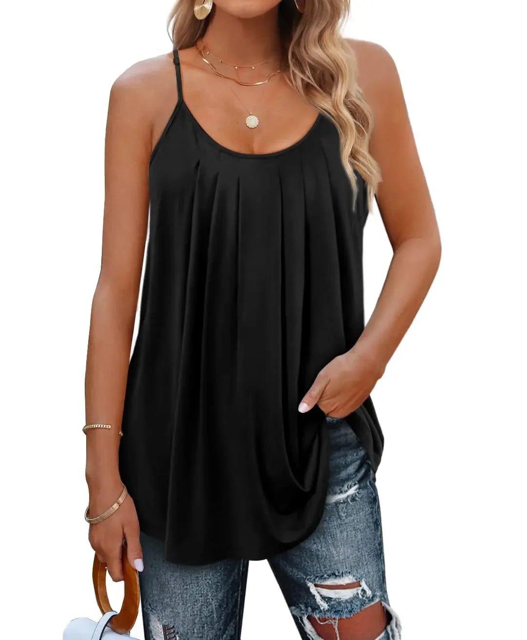 Black women's flowy camisole top with thin straps, paired with ripped jeans for casual fashion