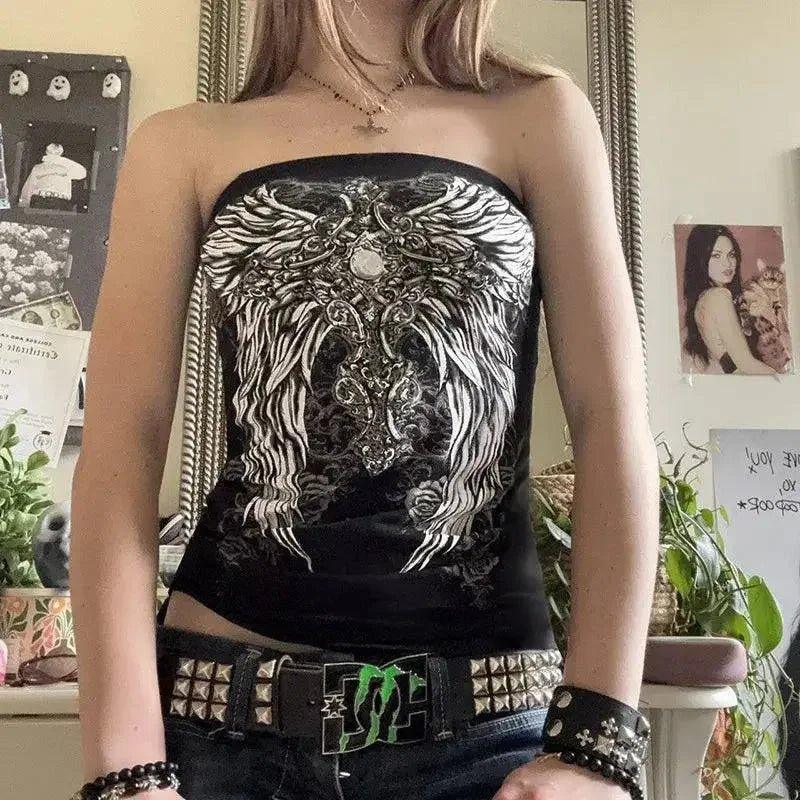 Black strapless top with white winged graphic, studded belt, and edgy accessories for women's fashion