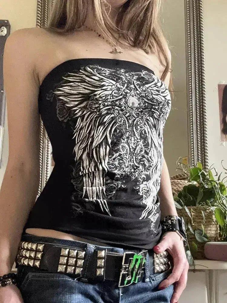 Woman wearing black strapless top with white angel wing print, studded belt, and jeans