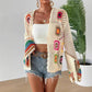 Boho crochet cardigan with floral patterns, paired with denim shorts and white top for women's fashion