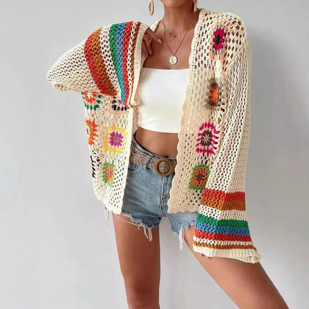 Boho crochet cardigan with colorful floral patterns, worn over white top and denim shorts for summer fashion.