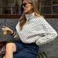 Woman in polka dot blouse and denim skirt, stylish street fashion outfit