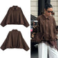 Brown oversized fashion jacket with cape sleeves, styled streetwear for women