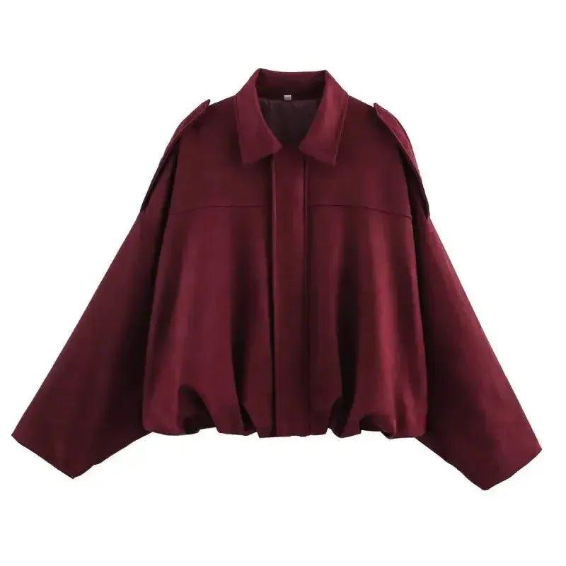 Burgundy women's fashion blouse with cape sleeves and collar detail