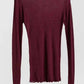 Burgundy long sleeve women's fashion top with textured knit and ruffled hem