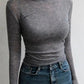 Gray long sleeve women's fitted top with high waist denim skirt, casual fashion outfit
