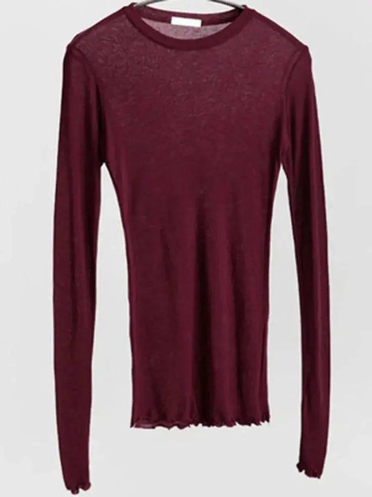 Burgundy long sleeve women's top with round neck and sheer texture, ideal for fashion layering