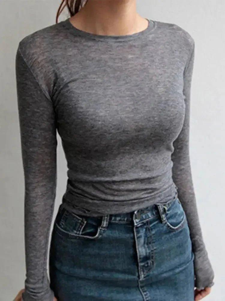 Gray long sleeve women's fitted top with ruched waist, paired with denim skirt for casual fashion