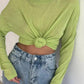 Lime green knotted crop top with long sleeves paired with high-waisted jeans, women's fashion