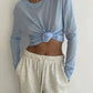Light blue knotted long sleeve top with cream drawstring joggers, women's casual fashion outfit