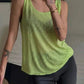 Lime green women's tank top with relaxed fit, styled with black leggings for casual fashion