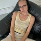 Woman in yellow tank top and knit headband, stylish casual fashion look