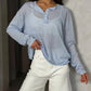 Woman in light blue long sleeve polo shirt and white denim shorts, casual fashion outfit