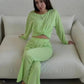 Woman in lime green crop top and wide-leg pants, casual fashion set