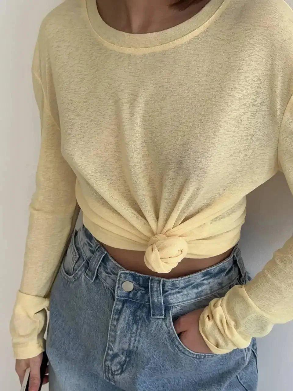 Yellow long sleeve crop top with front knot detail, paired with high waist jeans, women's fashion