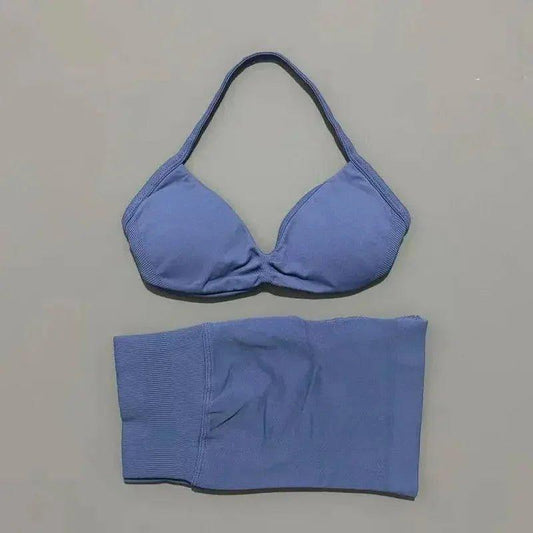 Blue women's bikini set with halter top and matching bottoms, ideal for beach fashion