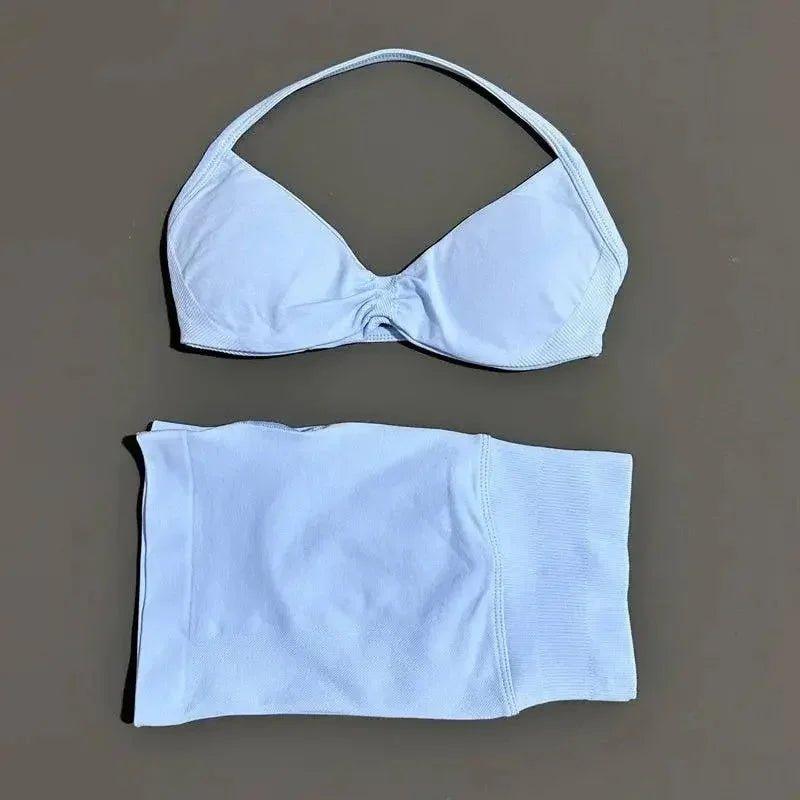 Light blue women's bikini set with halter top and matching bottoms