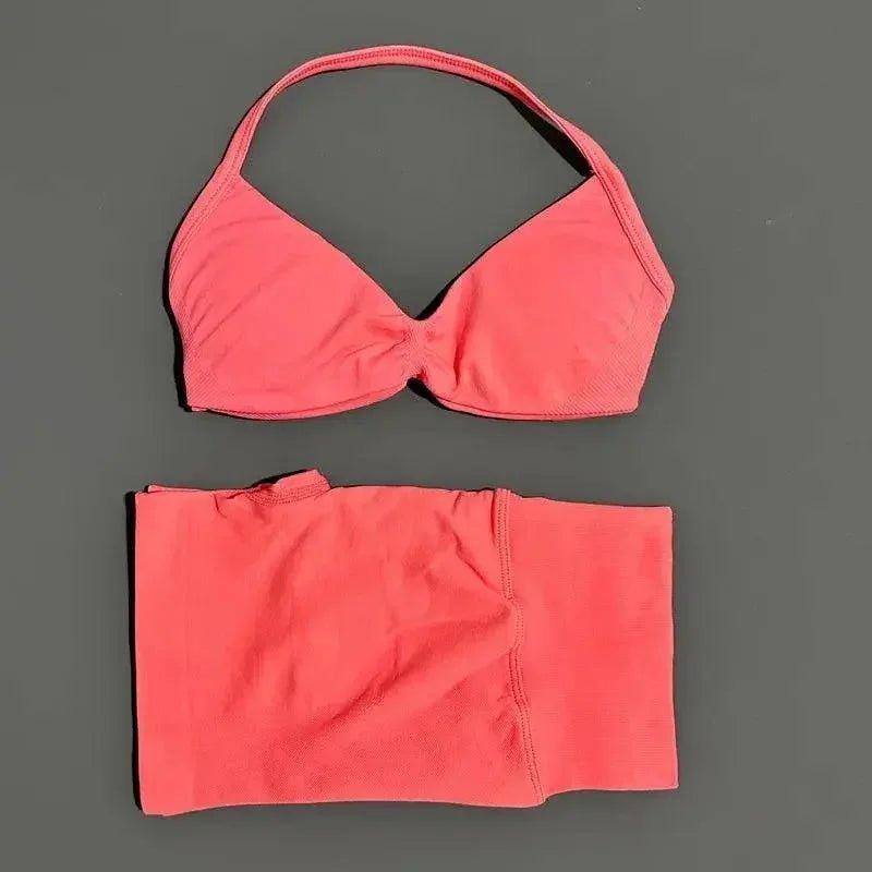 Coral pink halter bikini top and matching bottoms, women's swimwear fashion
