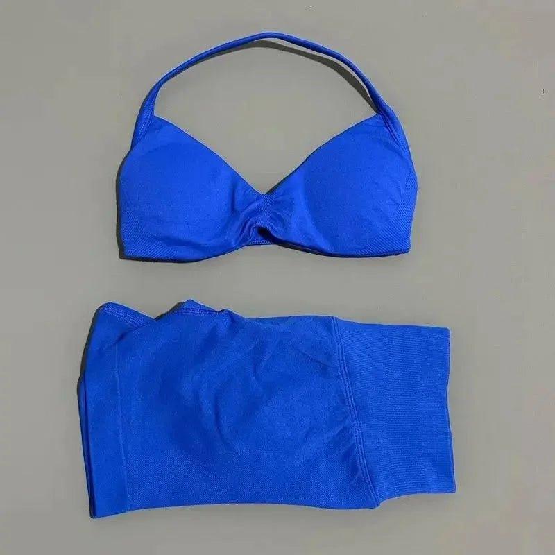 Vibrant blue women's bikini set with halter top and high-waisted bottoms, perfect for beach fashion