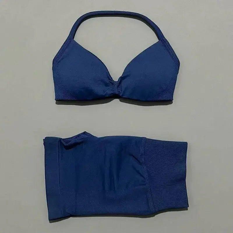 Blue women's bikini set with halter top and high-waisted bottoms