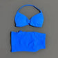 Vibrant blue women's bikini set with halter top and high-waisted bottoms, perfect for beach fashion