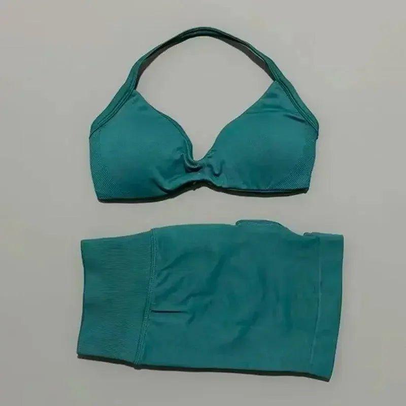 Teal women's bikini set with halter top and high-waisted bottoms