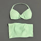 Mint green women's bikini set with halter top and high-waisted bottoms, soft fabric, minimalist design