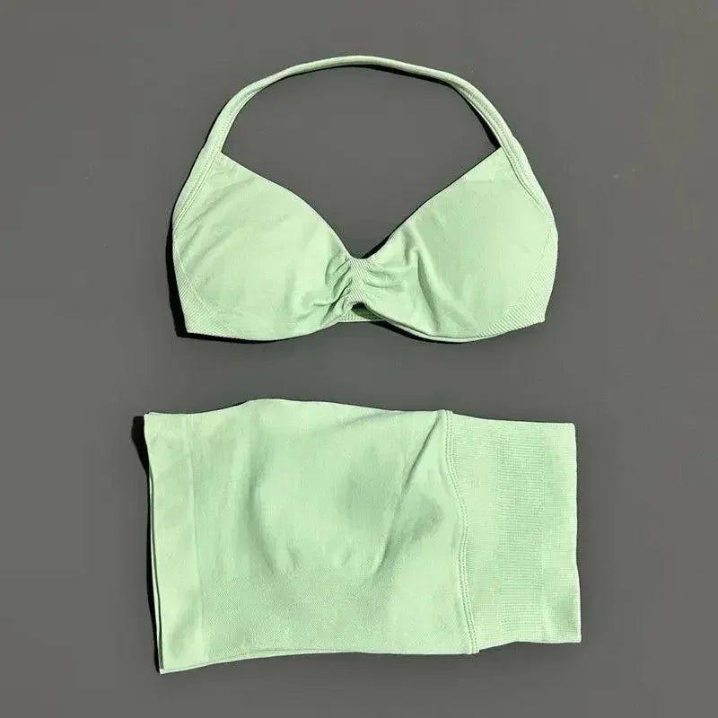 Mint green women's bikini set with halter top and high-waisted bottoms, soft fabric, minimalist design