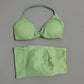 Light green women's bikini set with halter top and matching bottoms, soft fabric, minimalist design