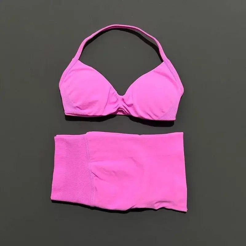 Pink halter bikini set with textured top and high-waisted bottoms, women's swimwear fashion