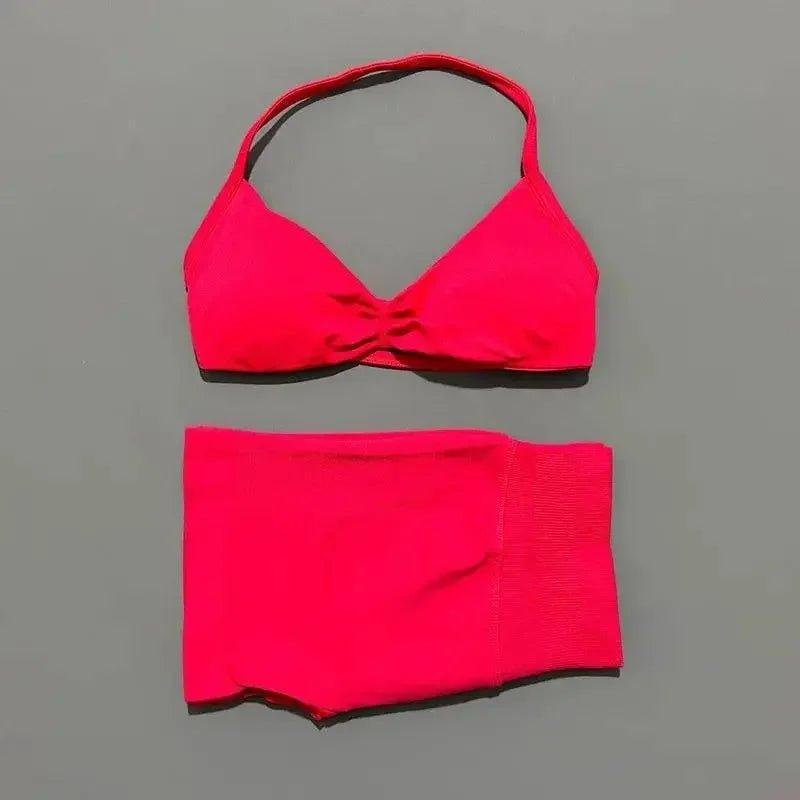 Vibrant red halter bikini set with knotted top and high-waisted bottoms, perfect for beach fashion.